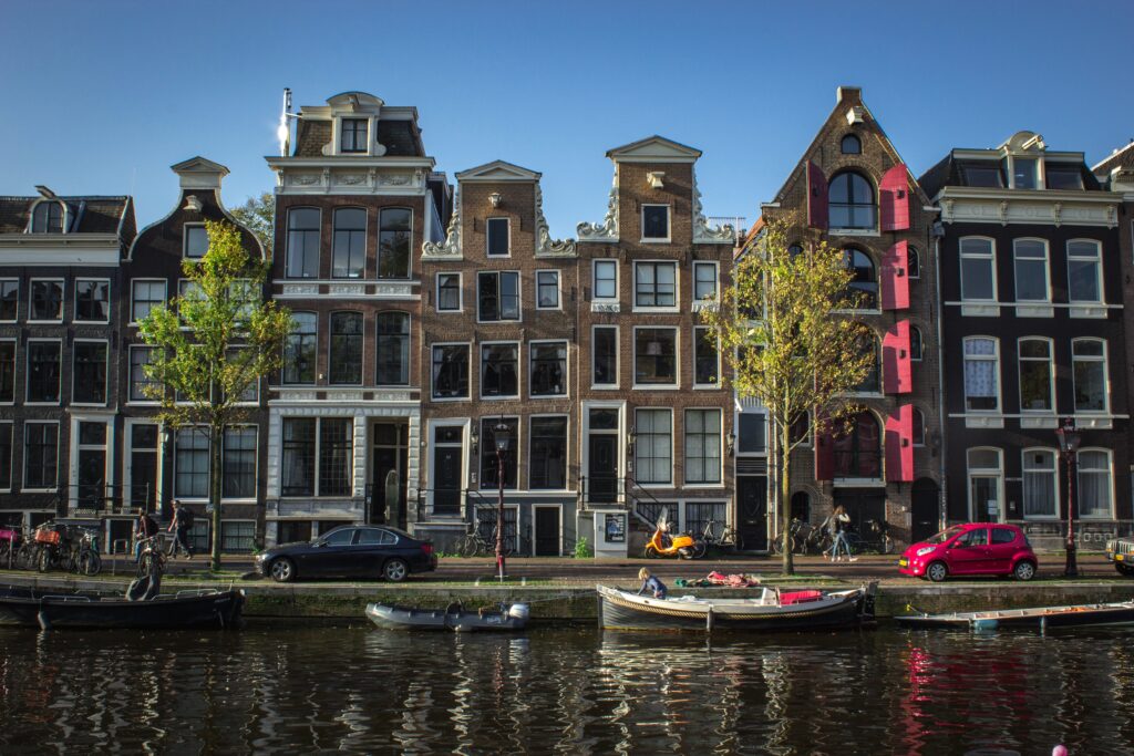 Amsterdam housing near the river, showcasing the picturesque canals and residential properties in the city.